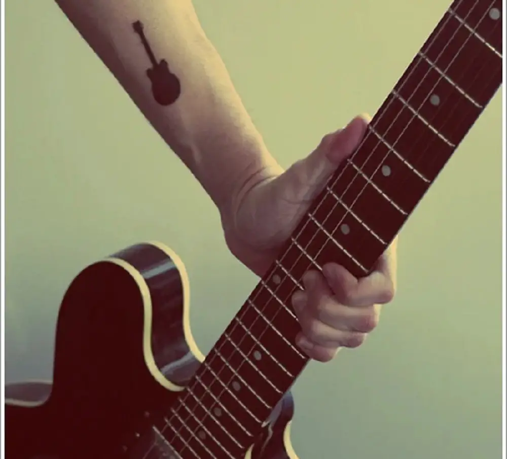 Small Guitar Tattoo